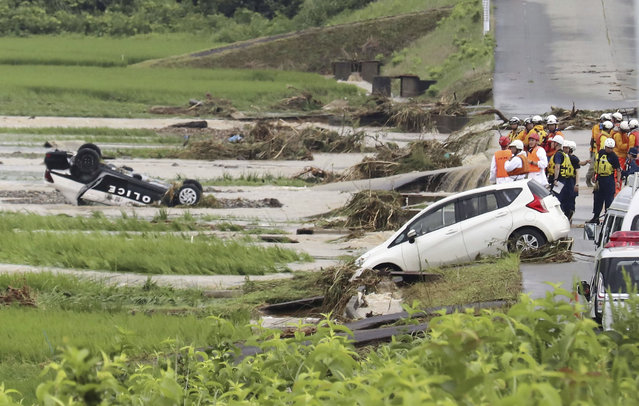 A police vehicle is seen overturned following a heavy rain in Shinjo, Yamagata prefecture, northern Japan Friday, July 26, 2024. Heavy rain hit northern Japan Thursday, triggering floods and landslides, disrupting transportation systems and forcing hundreds of residents to take shelter at safer grounds. (Photo by Kyodo News via AP Photo)