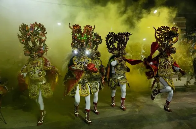 People perform the “Diablada de Oruro” dance in Oruro, Bolivia, Friday, October 1, 2021. Local authorities called for a “Diablazo Plurinacional” to claim the Diablada, the main dance of the Oruro Carnival, as its own in response to Peru which declared the dance as part of the cultural heritage of its nation. (Photo by Juan Karita/AP Photo)