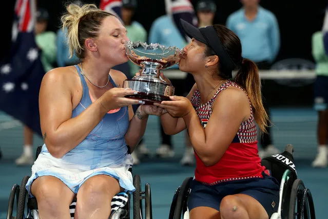 Great Britain’s Jordanne Whiley and Japan’s Yui Kamiji pose for photographs after winning their wheelchair doubles final against the Netherlands’ Diede de Groot and Anieke van Koot during day 12 of the Australian Open in Melbourne, Australia on January 31, 2020. (Photo by Rob Prezioso/AAP)
