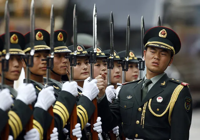Soldiers line up outside the Great Hall of the People in Beijing. (Photo by Kim Kyung-Hoon/Reuters)