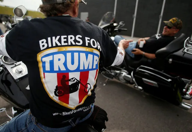 Mark Purcell, left, and Bill Wischmeier prepare to ride to a Bikers for Trump rally in Cleveland, Ohio, U.S., July 18, 2016. (Photo by Jim Urquhart/Reuters)
