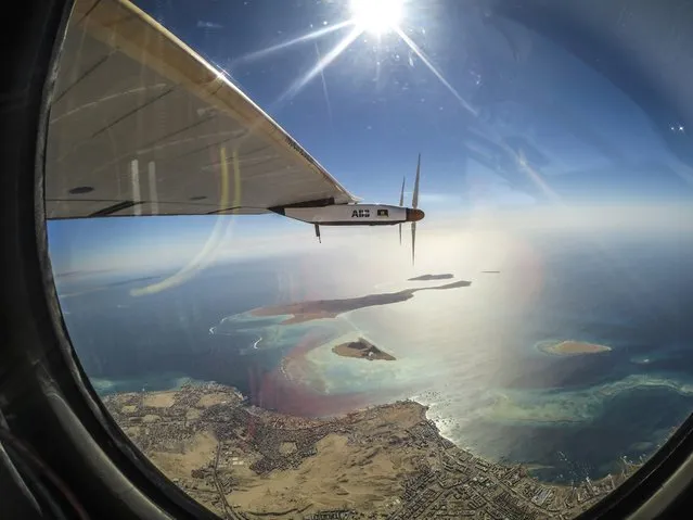 A handout picture made available by Solar Impulse on 26 July 2016, and shot by Swiss pilot Bertrand Piccard, shows Solar Impulse 2 (Si2) during its flight over the Red Sea, 24 July 2016, in the last leg of the Round-The-World journey as it heads to Abu Dhabi, UAE. Swiss long-range experimental solar-powered aircraft Si2 started its round-the-world solar flight from Abu Dhabi on 09 March 2015 and successfully completed it by returning to Abu Dhabi on 26 July 2016. (Photo by Jean Revillard/Bertrand Piccard/EPA)