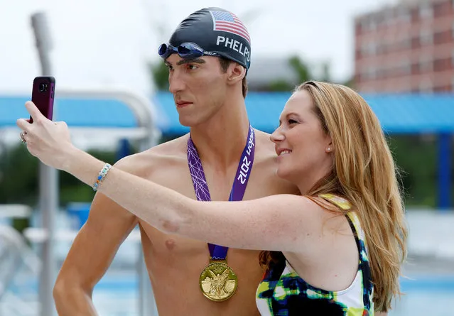 Lauren Cottrell takes a selfie next to a Madame Tussauds Museum figure of U.S. Olympic gold medal swimmer Michael Phelps at Banneker Pool in Washington, U.S., to coincide with the opening of the Rio Olympics August 5, 2016. (Photo by Gary Cameron/Reuters)