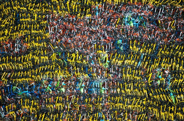About 10,000 bicycles, owned by bike sharing companies in the city, have been seized off the streets by authorities for being parked haphazardly in Shenzhen, China on September 28, 2017. (Photo by Imaginechina/Rex Features/Shutterstock)