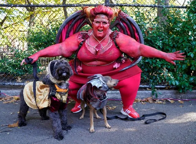 Dogs and their owners compete in the 32nd Tompkins Square Halloween Dog Parade on October 22, 2022, at Tompkins Square in New York City. (Photo by Timothy A. Clary/AFP Photo)