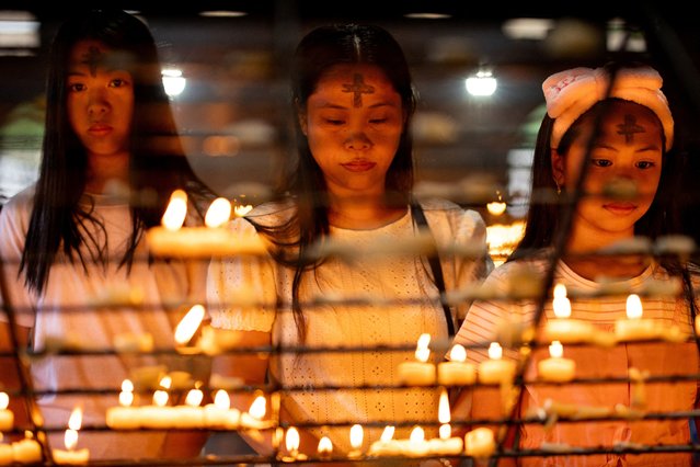 Filipino Catholics marked with ash crosses on their foreheads pray after offering candles on Ash Wednesday, at Baclaran Church, in Paranaque City, Metro Manila, Philippines, on March 5, 2025. (Photo by Eloisa Lopez/Reuters)