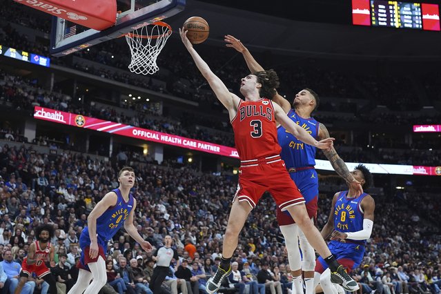 Chicago Bulls guard Josh Giddey (3) drives to the basket as, from left, Denver Nuggets guard Christian Braun, and forwards Michael Porter Jr. and Peyton Watson defend in the second half of an NBA basketball game Monday, March 24, 2025, in Denver. (Photo by David Zalubowski/AP Photo)