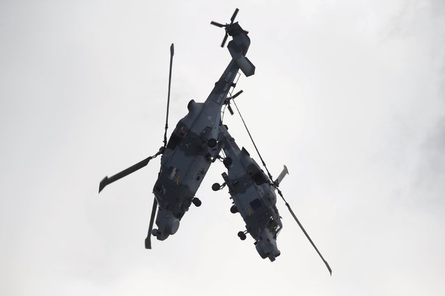AgustaWestland Wildcat HMA.2 helicopters of the Black Cats Helicopter Display Team, of the British Royal Navy Fleet Air Arm, take part in a display during the Malta International Airshow at Malta International Airport, outside Valletta, Malta, September 27, 2015. (Photo by Darrin Zammit Lupi/Reuters)