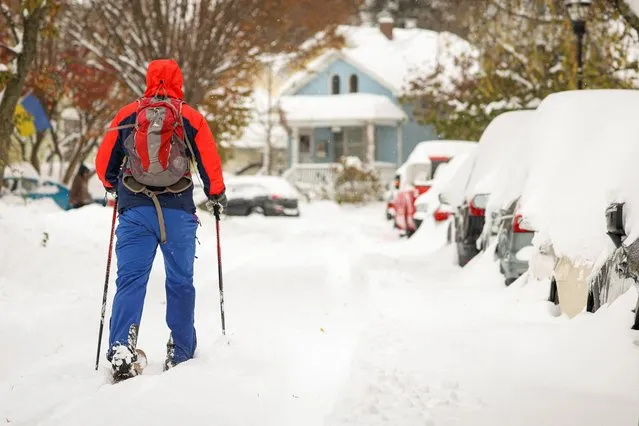 Resident cross country skis on the street during a snowstorm as extreme winter weather hits Buffalo, New York, U.S., November 19, 2022. (Photo by Lindsay DeDario/Reuters)