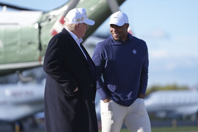 President Donald Trump, left, walks with Philadelphia Eagles football player Saquon Barkley before boarding Air Force One at Morristown Municipal Airport, Sunday, April 27, 2025, in Morristown, N.J. (Photo by Evan Vucci/AP Photo)