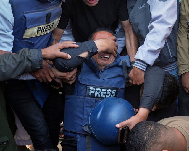 The funeral of Palestinian journalist Hassan Essliah on May 13, 2025, after he was killed in an Israeli strike on Nasser hospital in Gaza. (Photo by Jehad Alshrafi/AP Photo)