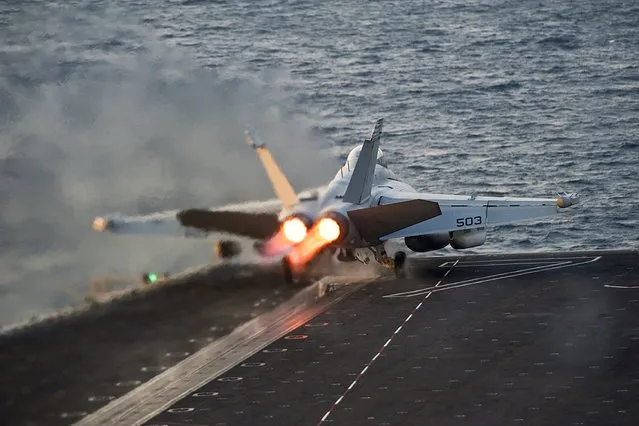 An EA-18G Growler launches from the Nimitz-class aircraft carrier USS Carl Vinson (CVN 70) in this U.S. Navy picture taken in the Arabian Gulf October 28, 2014. The United States targeted Islamic State militants on Sunday and Monday with five air strikes in Syria and nine in Iraq, according to U.S. Central Command. (Photo by Mass Communication Specialist 2nd Class John Philip Wagner Jr./Reuters/U.S. Navy)