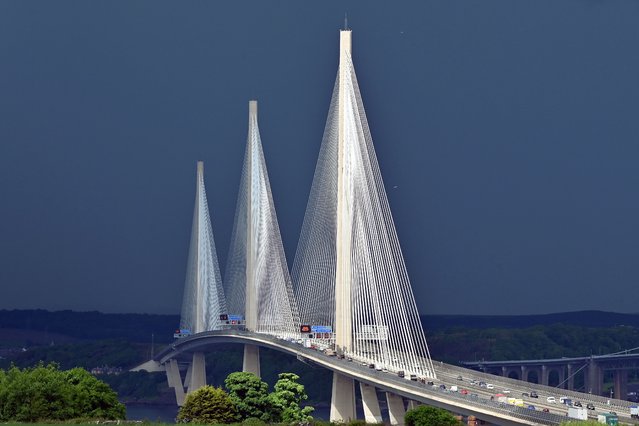 The Queensferry Crossing road bridge over the Forth Estuary is caught in sunlight between thundery downpours, as many parts of Scotland continue to be affected by heavy rain, on May 29, 2024 in South Queensferry, Scotland. (Photo by Ken Jack/Getty Images)