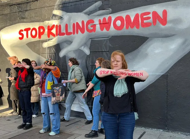 Handout photo issued by Rosa of people demonstrating against gender violence in front of a new mural by street artist Emmalene Blake in Dublin on Sunday, January 8, 2023, as they call for people to mark International Women's Day with a day of action against femicide. (Photo by Rosa/PA Media)
