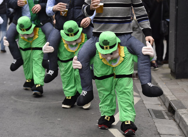 Rugby Union, New Zealand vs France, IRB Rugby World Cup 2015 Quarter Final, Millennium Stadium, Cardiff, Wales on October 17, 2015: Ireland fans wearing costumes outside the Millennium Stadium. (Photo by Toby Melville/Reuters)