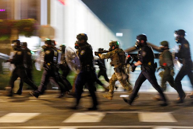 ICE agents charge towards protesters during a protest against President Trump' immigration policies, outside an ICE detention facility in Portland, Oregon, U.S., on September 1, 2025. (Photo by John Rudoff/Reuters)
