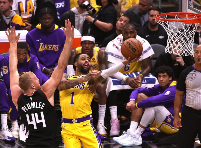 D'Angelo Russell #1 of the Los Angeles Lakers attempts a layup as he is fouled by Mason Plumlee #44 of the LA Clippers during the first half at Crypto.com Arena on April 05, 2023 in Los Angeles, California. (Photo by Harry How/Getty Images)