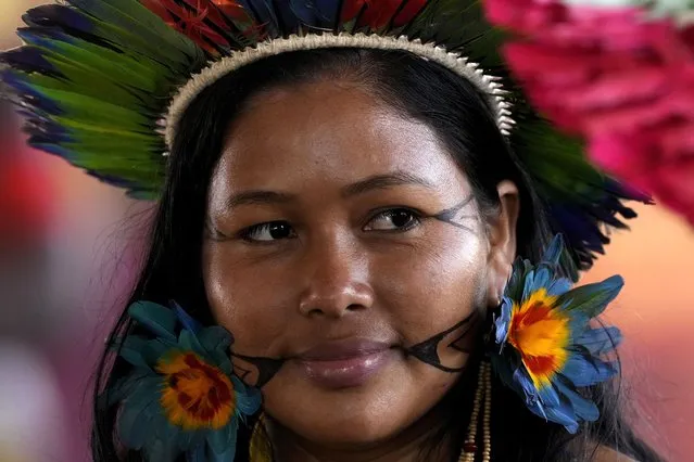 An Indigenous woman attends the closing of the annual Terra Livre, or Free Land Indigenous Encampment in Brasilia, Brazil, Friday, April 28, 2023. (Photo by Eraldo Peres/AP Photo)