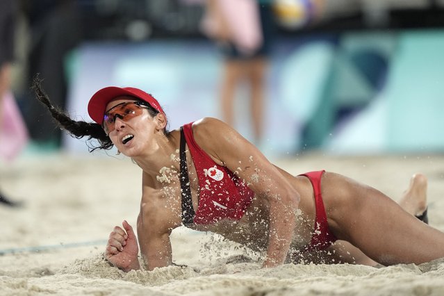 Canada's Heather Bansley watches her return shot in a beach volleyball match against Switzerland at the 2024 Summer Olympics, Wednesday, July 31, 2024, in Paris, France. (Photo by Robert F. Bukaty/AP Photo)
