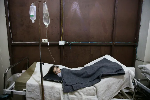 An injured girl rests in a field hospital, after an air strike on a kindergarten in the rebel-held besieged city of Harasta, in the eastern Damascus suburb of Ghouta, Syria November 6, 2016. (Photo by Bassam Khabieh/Reuters)