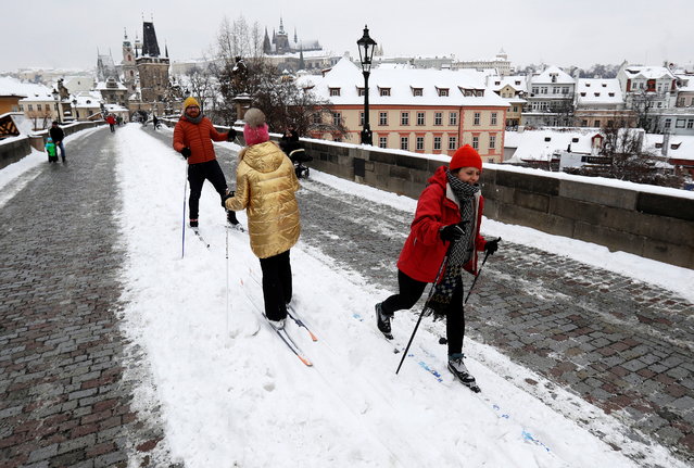 People cross-country ski across the medieval Charles Bridge in Prague, Czech Republic, February 9, 2021. (Photo by David W. Cerny/Reuters)