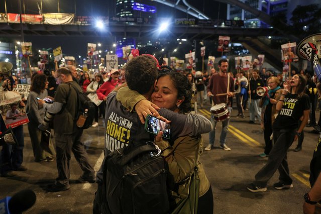 Supporters of Israeli hostages, who were kidnapped during the deadly October 7 2023 attack by Hamas, react to news on the Gaza ceasefire negotiations, during a protest to demand a deal to bring every hostage home, in Tel Aviv, Israel, on January 15, 2025. (Photo by Ronen Zvulun/Reuters)