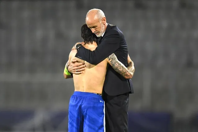 Italy's Sandro Tonali gets a hug from Italy's coach Paolo Nicolato at the end of the Euro 2023 U21 Championship soccer match between Italy and Norway at the Cluj Arena stadium in Cluj, Romania, Wednesday, June 28, 2023. (Photo by Raed Krishan/AP Photo)