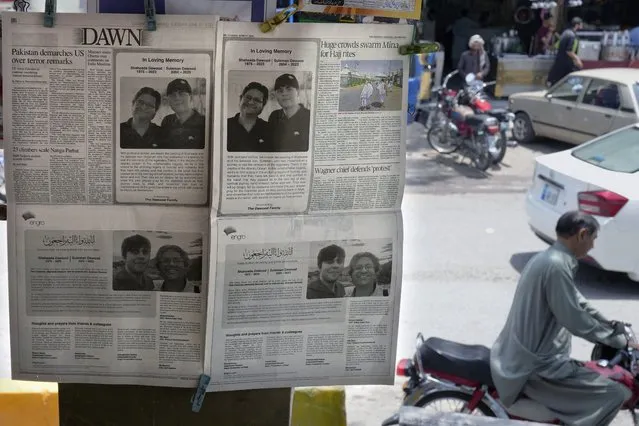 Morning newspapers publish an ad of condolence massages for two victims of Titan submersible incident, Shahzada Dawood and his son Suleman Dawood, by their family and firm, displayed at a roadside stall, in Islamabad, Pakistan, Tuesday, June 27, 2023. As an international group of agencies investigates why the Titan submersible imploded while carrying five people to the Titanic wreckage, U.S. maritime officials say they'll issue a report aimed at improving the safety of submersibles worldwide. (Photo by Anjum Naveed/AP Photo)