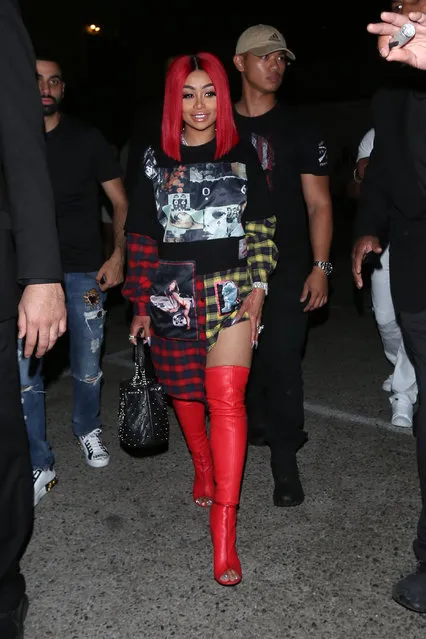 Blac Chyna proudly shows off her new red hair as she leaves the Ace of Diamonds club in Los Angeles, CA on August 14, 2018. Amber Rose was also inside the club partying the night away with Blac Chyna. At one point, Blac Chyna flips the bird to the photographers. She was playfully making obscene hand gestures. (Photo by Photographer Group/Splash News and Pictures)