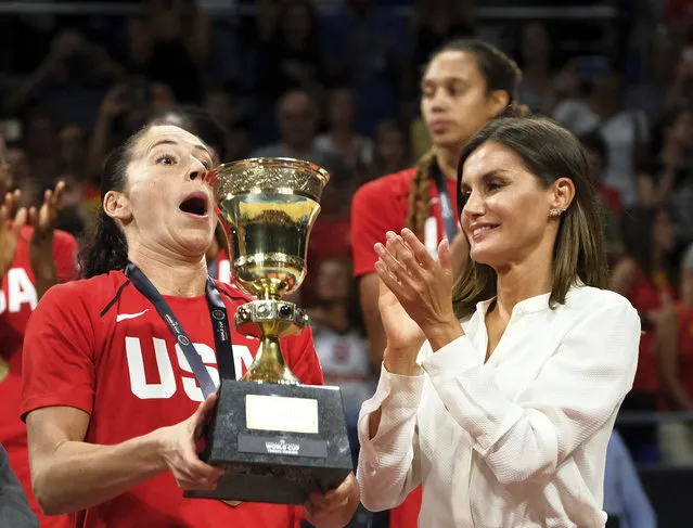 Sue Bird of the United States, left, lifts the trophy as Queen Letizia applauds after winning the Women's Basketball World Cup final match against Australia in Tenerife, Spain, Sunday, September 30, 2018. (Photo by Andres Gutierrez/AP Photo)