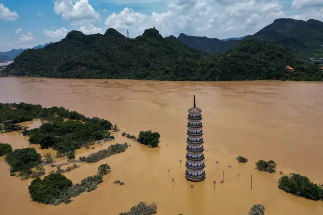 An aerial view of the flooding place as flooding grips in Yingde, Guangdong Province of China on June 23, 2022. After the water level of Beijiang river rose, Yingde City suffered serious flood disaster. (Photo by Stringer/Anadolu Agency via Getty Images)