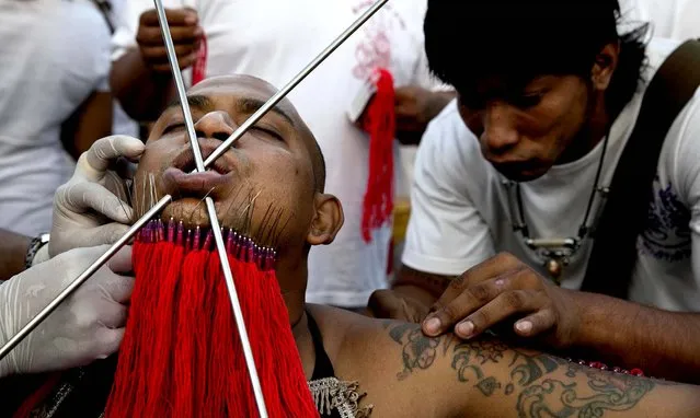 A devotee is pierced. (Photo by Paula Bronstein/Getty Images)