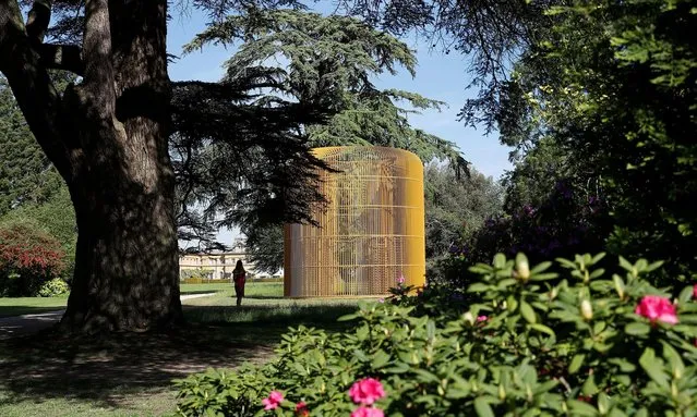 Artist Ai Weiwei's Gilded Cage (2017) sculpture is seen in the grounds of Blenheim Palace after being unveiled by the Blenheim Art Foundation in Woodstock, Britain, June 2, 2021. (Photo by Peter Nicholls/Reuters)