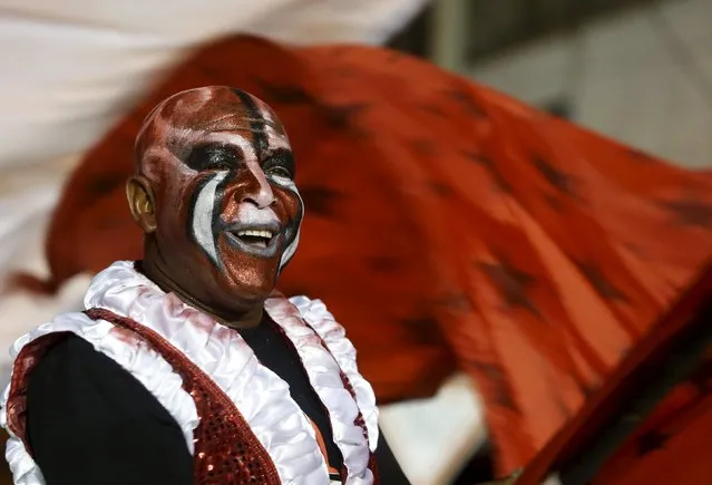 A member of a comparsa, a Uruguayan carnival group, dances during the Llamadas parade in Montevideo February 5, 2016. (Photo by Andres Stapff/Reuters)