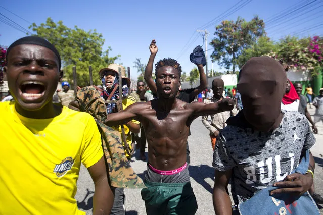 Protesters chant anti-government slogans demanding the resignation of President Jovenel Moise in Port-au-Prince, Haiti, Monday, February 11, 2019. (Photo by Dieu Nalio Chery/AP Photo)