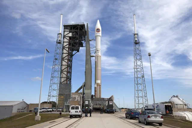 The United Launch Alliance Atlas V rocket and Orbital ATK Cygnus spacecraft stack sits on the launch pad at Cape Canaveral Air Force Station in Cape Canaveral, Fla., Monday, March 21, 2016. The cargo carrier is scheduled to launch Tuesday, March 22, and holds a commercial-quality 3D printer for astronaut as well as public use, for a price. (Photo by Ben Smegelsky/NASA via AP Photo)