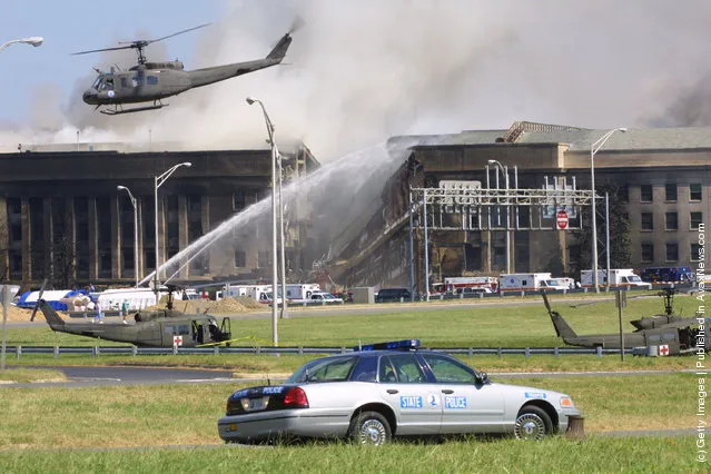 Smoke comes out from the west wing of the Pentagon building September 11, 2001 in Arlington, Va., after a plane crashed into the building and set off a huge explosion