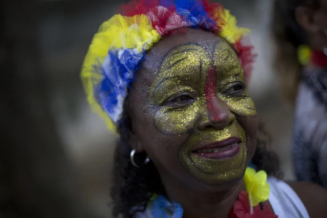 A patient from the Nise da Silveira Mental Health Institute takes part on a carnival parade coined, in Portuguese: “Loucura Suburbana”, or Suburban Madness, in the streets of Rio de Janeiro, Brazil, Thursday, February 23, 2017. (Photo by Silvia Izquierdo/AP Photo)