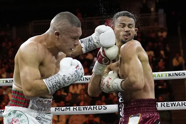 Isaac Cruz, of Mexico, hits Rolando Romero in a super lightweight title bout Saturday, March 30, 2024, in Las Vegas. (Photo by John Locher/AP Photo)