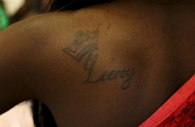 A tattoo with “Leeroy” is seen on the contestant's shoulder while preparing backstage ahead of the Miss Gay Jozi pageant in Johannesburg, May 23, 2015. (Photo by Siphiwe Sibeko/Reuters)