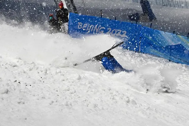 Ukraine's Olga Polyuk falls while taking part in a practice session ahead of the freestyle skiing women's aerials qualification during the Beijing 2022 Winter Olympic Games at the Genting Snow Park A & M Stadium in Zhangjiakou on February 13, 2022. (Photo by Marco Bertorello/AFP Photo)