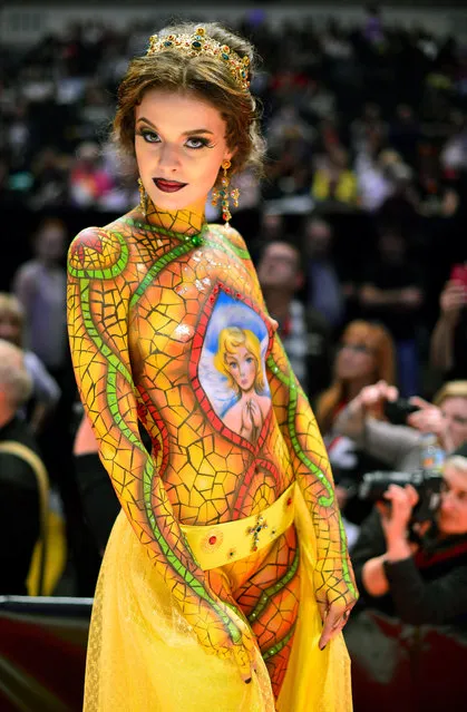 A model poses after the contest “Body Painting” of the OMC Hairworld World Cup on May 4, 2014 in Frankfurt am Main, Germany. The OMC Hairworld World Cup will be held in Frankfurt from 3 to 5 May 2014, parallel to the Hair and Beauty 2014 fair. Around 1.250 participants from 50 countries fight in different contest for the titles. (Photo by Thomas Lohnes/Getty Images)