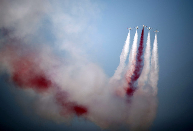 Turkish acrobatic aircrafts fly over a military parade to mark the 1974 Turkish invasion of Cyprus in response to a short-lived Greek-inspired coup, in the Turkish-controlled northern Cyprus, in the divided city of Nicosia, Cyprus on July 20, 2024. (Photo by Yiannis Kourtoglou/Reuters)