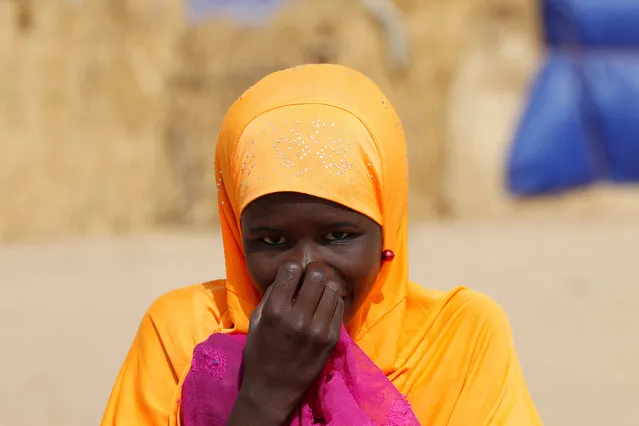 A Nigerien displaced girl reacts at a camp of the city of Diffa, Niger June 18, 2016. (Photo by Luc Gnago/Reuters)