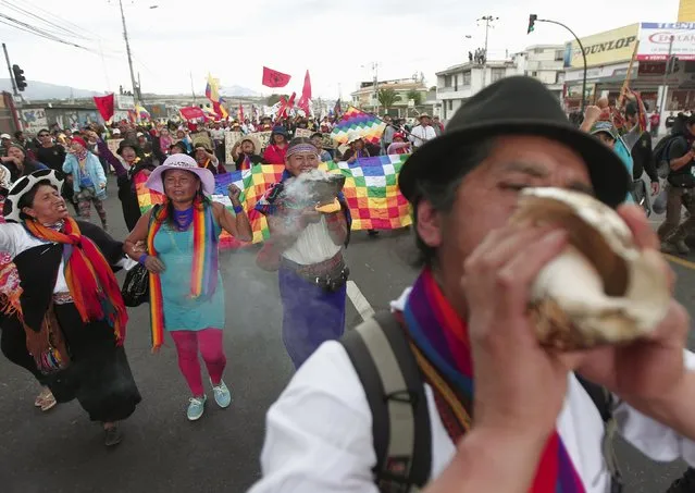 An man blows a conch while marching with fellow protesters in Guamani, on the outskirts of Quito, Ecuador, August 12, 2015. Ecuadorean Indigenous from the Confederation of Indigenous Nationalities of Ecuador (CONAIE) are marching towards Quito to participate in a nation-wide strike on August 13 against the government of Ecuador's President Rafael Correa, according to local media. (Photo by Guillermo Granja/Reuters)