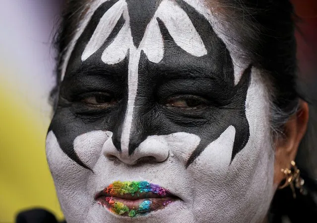 A women, her lips painted with rainbow colors, attends the 2nd annual Lencha March to celebrate sеx-affective relationships between cis women, trans women, lesbians, pansexuals, non-binary, queer, asеxuals, and trans men, in celebration of Pride Month, in Mexico City, Saturday, June 18, 2022. (Photo by Fernando Llano/AP Photo)