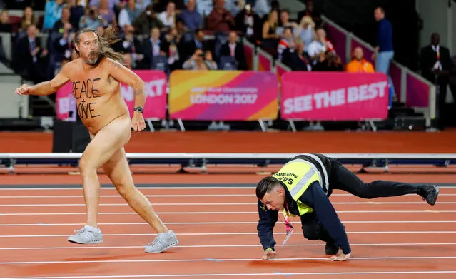 A streaker is chased by a steward after invading the track at the 2017 IAAF World Championships at the London Stadium in London on August 5, 2017. (Photo by Kai Pfaffenbach/Reuters)