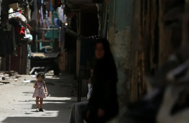 An Egyptian girl walks on a street during the holy month of Ramadan in old Cairo, Egypt June 1, 2016. (Photo by Amr Abdallah Dalsh/Reuters)