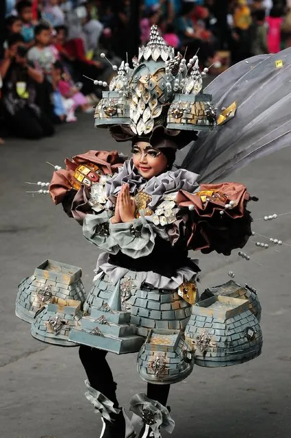 A model wears a Borobudur costume in the kids carnival during The 13th Jember Fashion Carnival 2014 on August 21, 2014 in Jember, Indonesia. (Photo by Robertus Pudyanto/Getty Images)