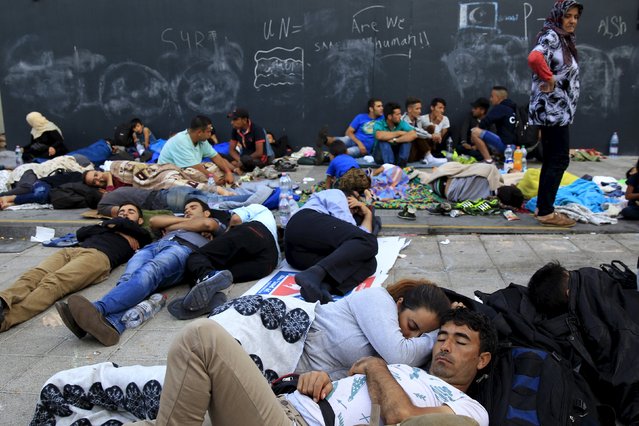 Migrants rest at an underground station near the main Eastern Railway station in Budapest, Hungary, September 2, 2015. (Photo by Bernadett Szabo/Reuters)